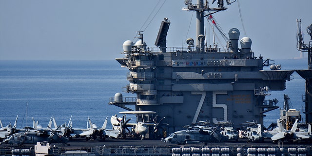 FILE- The aircraft carrier USS Harry S. Truman arrives at the French port of Marseille in the Mediterranean.