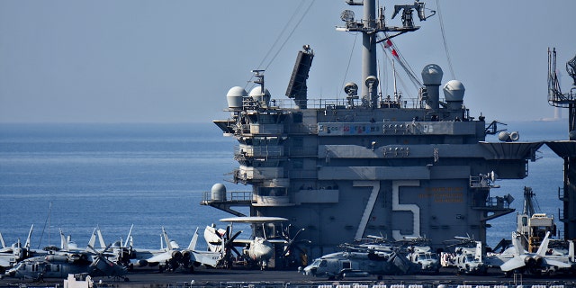 FILE- The aircraft carrier USS Harry S. Truman arrives at the French port of Marseille in the Mediterranean.