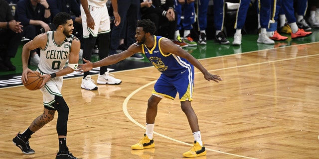 NBA Finals: Golden State Warriors Andrew Wiggins in action, defending vs. Boston Celtics at TD Garden.