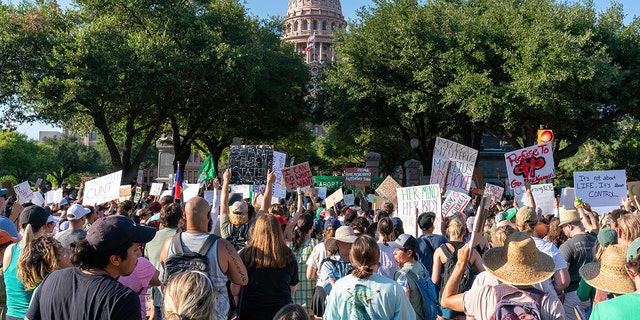 Abortion rights demonstrators gather near the State Capitol in Austin, Texas, June 25, 2022.