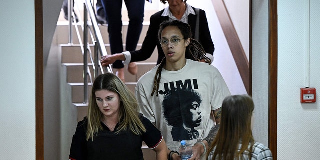 WNBA basketball superstar Brittney Griner (C) arrives to a hearing at the Khimki Court, outside Moscow on July 1, 2022.