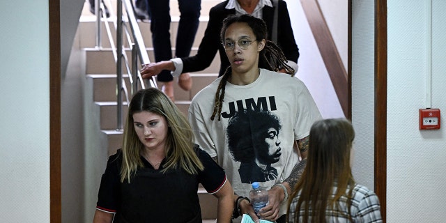 WNBA basketball superstar Brittney Griner (C) arrives to a hearing at the Khimki Court, outside Moscow on July 1, 2022.