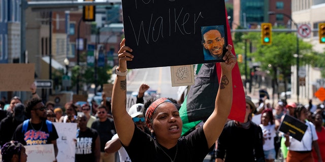 Demonstrators gather outside City Hall to protest the killing of Jayland Walker in Akron, Ohio, July 3, 2022.