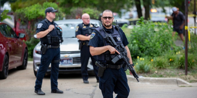 HIGHLAND PARK, IL: First responders work the scene of a mass shooting at a Fourth of July parade on July 4, 2022.