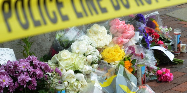 HIGHLAND PARK, ILLINOIS: Flowers and cards are placed near a spot where a mass shooting took place during the 4th of July parade in Highland Park, Illinois.