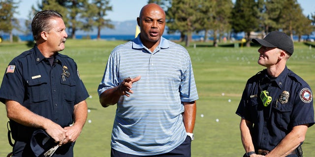 Sports analyst Charles Barkley talks to the Tahoe Douglas Fire Department about their efforts before teeing off Round Two of the 2022 American Century Championship at Edgewood Tahoe Golf Course in Stateline, Nev., on July 9, 2022.
