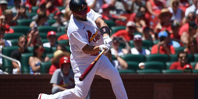 Albert Pujols, #5 of the St. Louis Cardinals, hits a single against the Philadelphia Phillies in the second inning at Busch Stadium on July 10, 2022 in St Louis, Missouri. 