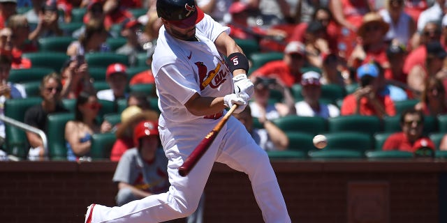 Albert Pujols, No. 5 in the house of St. Louis Cardinals hits a single against the Philadelphia Phillies in the second inning at Bush Stadium on July 10, 2022 in St. Louis, Missouri.