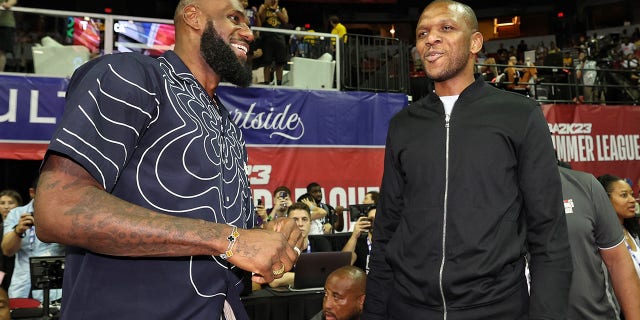 LeBron James #6 of the Los Angeles Lakers talks with General Manager of the Phoenix Suns, James Jones during the 2022 NBA Summer League at the Thomas & Mack Center on July 8, 2022, in Las Vegas, Nevada.