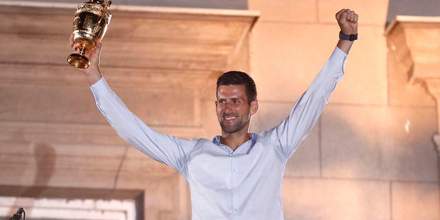 Serbia's Novak Djokovic celebrates his victory at the Wimbledon tennis tournament with supporters during a welcoming ceremony in Belgrade, Serbia, on July 11, 2022.