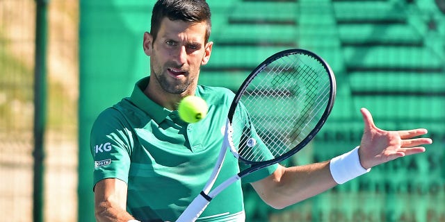 Serbian tennis player Novak Djokovic returns the ball during an exhibition match in Visoko, Bosnia and Herzegovina, on July 13, 2022.