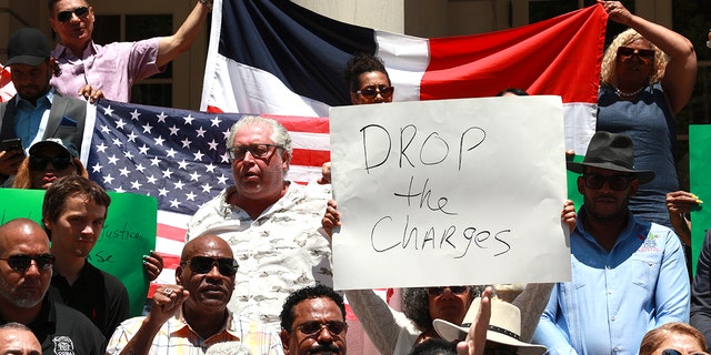 Members of the Dominican Republic Community, bodega owners and different associations are pictured on the steps of City Hall during press conference asking Manhattan D. A. Alvin Bragg to drop charges against bodega worker Jose Alba accused of killing a robber during a fight at a bodega where he worked. 