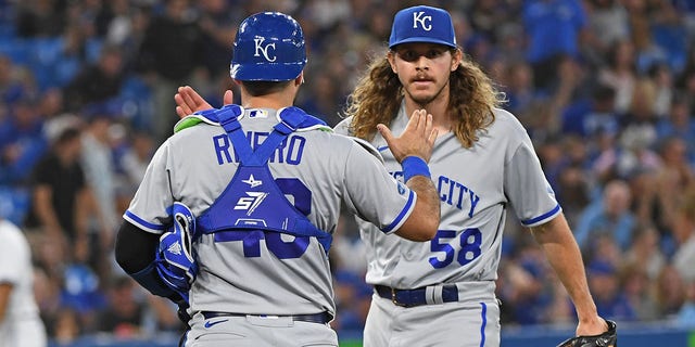 Kansas City Royals Catcher Sebastian Rivero (48) and Pitcher Scott Barlow (58) celebrate the win after the regular season MLB game between the Kansas City Royals and Toronto Blue Jays on July 14, 2022 at Rogers Centre in Toronto, ON. 