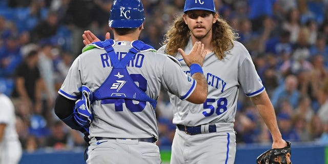 Kansas City Royals Catcher Sebastian Rivero (48) and Pitcher Scott Barlow (58) celebrate the win after the regular season MLB game between the Kansas City Royals and Toronto Blue Jays on July 14, 2022 at Rogers Centre in Toronto, ON.