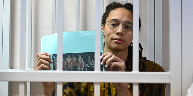 WNBA basketball superstar Brittney Griner sits inside a defendants' cage during a hearing at the Khimki Court in the town of Khimki, outside Moscow, on July 15, 2022.