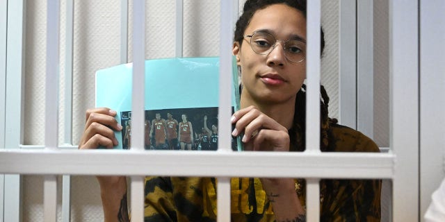 WNBA superstar Britney Greener sits in the defendant's cage on July 15, 2022, at a hearing at the Khimki Court in the town of Khimki on the outskirts of Moscow.