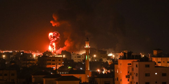 Fires are seen after an Israeli airstrike on Gaza City on July 16, 2022.