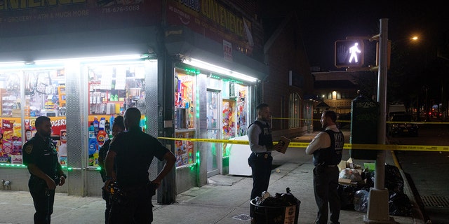 NYPD officers investigate an unrelated shooting at 1461 Southern Boulevard in the Bronx, New York City on Sunday, July 17, 2022. 