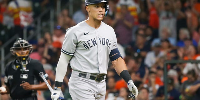 New York Yankees designated hitter Aaron Judge, #99, reacts after striking out in the top of the seventh inning during the MLB doubleheader Game 2 between the New York Yankees and Houston Astros on July 21, 2022 at Minute Maid Park in Houston, Texas.  