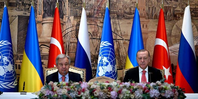 United Nations (UN) Secretary-General Antonio Guterres (L) and Turkish President Recep Tayyip Erdogan (R) sit at the start of the signature ceremony of an initiative on the safe transportation of grain and foodstuffs from Ukrainian ports, in Istanbul, on July 22, 2022. 