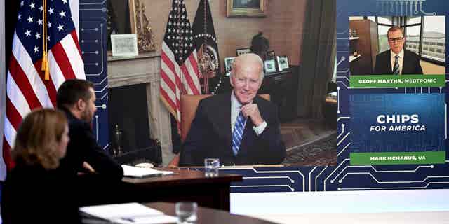 US President Joe Biden speaks virtually during a meeting with CEOs and labor leaders regarding the Chips Act, in the South Court Auditorium of the Eisenhower Executive Office Building, next to the White House, in Washington, DC, on July 25, 2022. (Photo by Brendan SMIALOWSKI / AFP) (Photo by BRENDAN SMIALOWSKI/AFP via Getty Images)