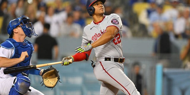 Juan Soto (22) of the Washington Nationals follows through during the fifth inning against the Los Angeles Dodgers at Dodger Stadium, July 26, 2022, in Los Angeles, California.