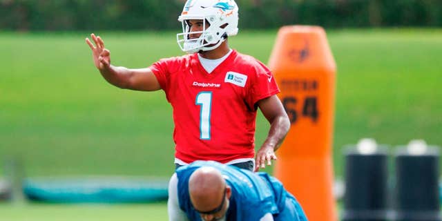 Miami Dolphins quarterback Tua Tagovailoa executes drills during training camp at Baptist Health Training Complex in Hard Rock Stadium in Miami Gardens, Fla., on Wednesday, July 27, 2022.