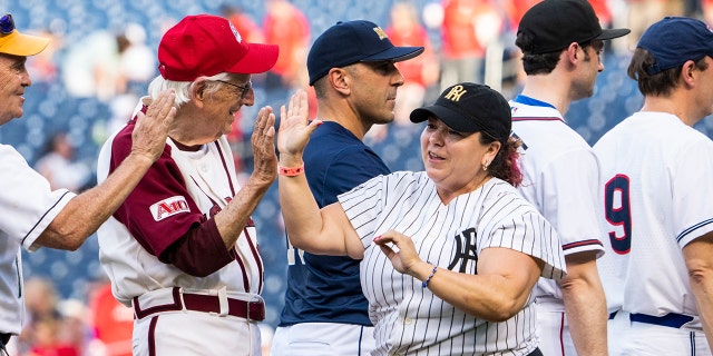 Linda Sanchez in pinstripes takes the field