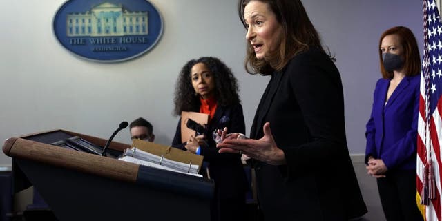 Co-Chair and Executive Director of the Gender Policy Council Jennifer Klein, center, speaks as Co-Chair of the Gender Policy Council and Chief of Staff to the first lady Julissa Reynoso, left, and White House press secretary Jen Psaki, right, listen during a daily press briefing at the James Brady Press Briefing Room of the White House March 8, 2021, in Washington, D.C.
