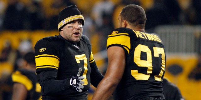 Ben Roethlisberger of the Steelers talks to Cameron Heyward during warmups before the Cleveland Browns game on Dec. 8, 2011, at Heinz Field in Pittsburgh.  