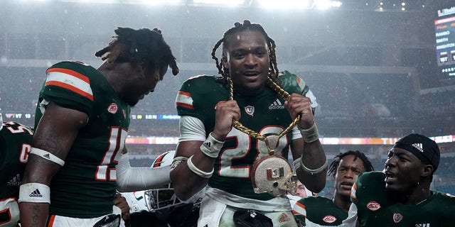 Marcus Clarke, #28 of the Miami Hurricanes, celebrates with the revenue chain after recovering from a fumble against the Virginia Tech Hokies at Hard Rock Stadium on Nov. 20, 2021 in Miami Gardens, Florida. 