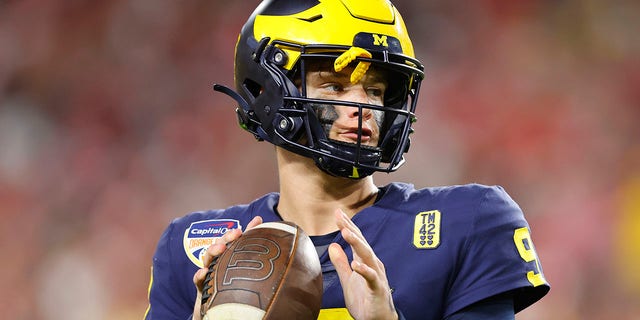 J.J. McCarthy, #9 of the Michigan Wolverines, in action against the Georgia Bulldogs in the Capital One Orange Bowl for the College Football Playoff semifinal game at Hard Rock Stadium on December 31, 2021 in Miami Gardens, Florida. 