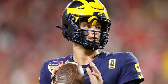 J.J. McCarthy, #9 of the Michigan Wolverines, in action against the Georgia Bulldogs in the Capital One Orange Bowl for the College Football Playoff semifinal game at Hard Rock Stadium on December 31, 2021 in Miami Gardens, Florida.
