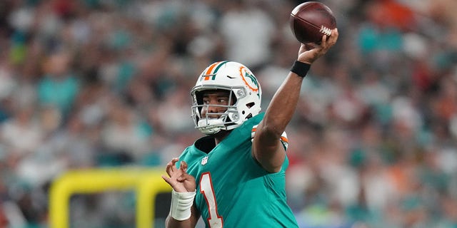 Tua Tagovailoa of the Miami Dolphins in action against the New England Patriots at Hard Rock Stadium in Miami Gardens, Fla., on Jan. 9, 2022.