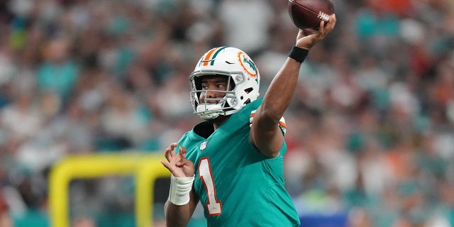 Tua Tagovailoa of the Miami Dolphins in action against the New England Patriots at Hard Rock Stadium in Miami Gardens, Fla., on Jan. 9, 2022.
