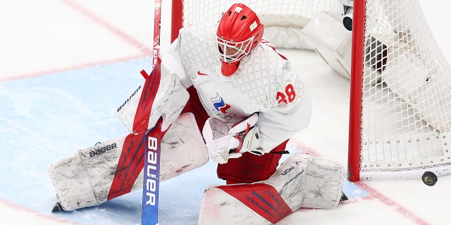 Ivan Fedotov of Team ROC blocks a shot in the first period during the men's ice hockey gold medal match between Team Finland and Team ROC on Day 16 of the Beijing 2022 Winter Olympic Games at National Indoor Stadium Feb. 20, 2022, in Beijing, China. 