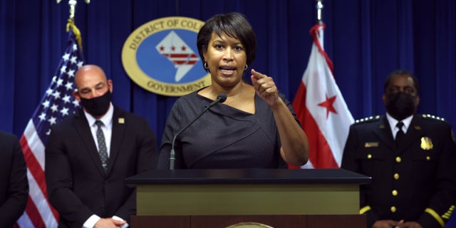 WASHINGTON, DC - FEBRUARY 28: Washington DC Mayor Muriel Bowser (C) speaks during a press conference on February 28, 2022 in Washington, DC.