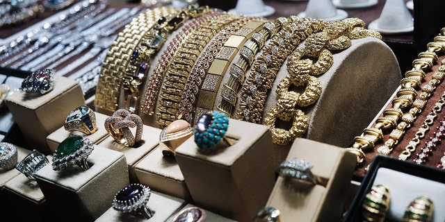 Gold jewelry is displayed in a window of a store in Manhattan's jewelry district on March 07, 2022 in New York City. 
