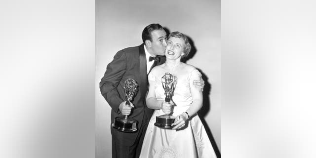 Carl Reiner and Pat Carroll pose with their awards during the 9th annual Primetime Emmy Awards, March 16, 1957, at the Colonial Theatre in New York City.