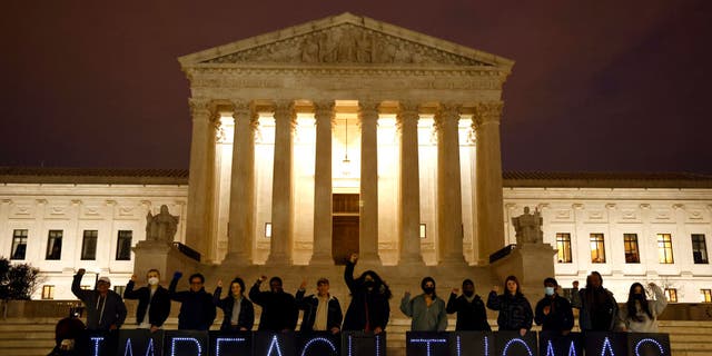 MoveOn activists call for the impeachment of Justice Clarence Thomas outside the U.S. Supreme Court on March 30, 2022 in Washington, DC.