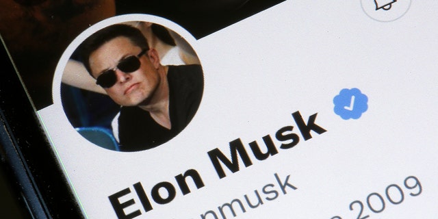 In this photo illustration, the Elon Musk’s Twitter account is displayed on the screen of an iPhone on April 26, 2022 in Paris, France. (Photo illustration by Chesnot/Getty Images)