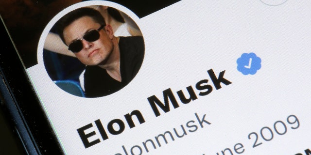 Elon Musk’s Twitter account is displayed on the screen of an iPhone(Photo illustration by Chesnot/Getty Images)