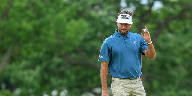 Bubba Watson, of the United States, reacts to his putt with a ball wave on the first green during the final round of the 2022 PGA Championship at Southern Hills Country Club on May 22, 2022 in Tulsa, Oklahoma.
