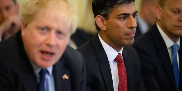 LONDON, ENGLAND - JUNE 07: Britain's Chancellor Rishi Sunak (C) listens as Prime Minister Boris Johnson (L) addresses his Cabinet ahead of the weekly Cabinet meeting in Downing Street on June 07, 2022 in London, England. The Prime Minister survived a confidence vote last night but potentially has long-term problems ahead as he faces rebellion within his party. (Photo by Leon Neal - WPA Pool/Getty Images)