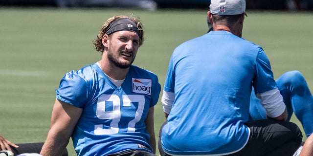 Los Angeles Chargers' Joey Botha speaks with head coach Brandon Staley during a mandated minicamp at the Chargers' training facility in Costa Mesa, Calif., June 15, 2022. 