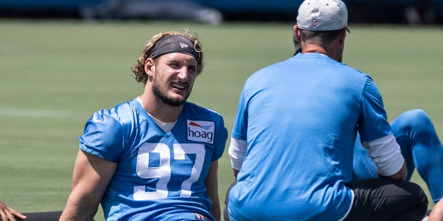 The Los Angeles Chargers' Joey Bosa talks with head coach Brandon Staley during a mandatory minicamp at the Chargers' training facility in Costa Mesa, Calif., June 15, 2022.