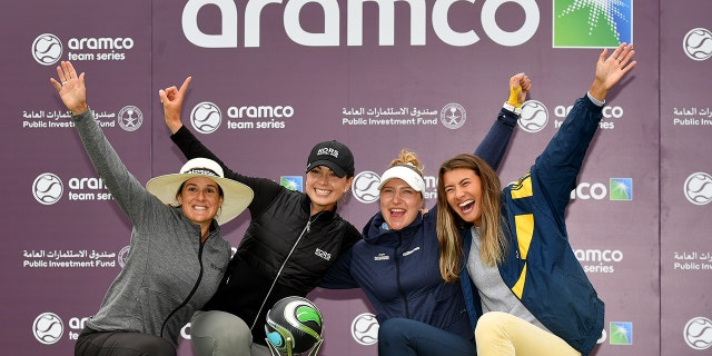 From left, Mia Baker of England, Nicole Garcia of South Africa, Madelene Stavnar of Norway and Kelly Whaley of the U.S. celebrate with the trophy after winning the Team Event on Day Three of the Aramco Team Series London at The Centurion Club in St Albans, England, on June 18, 2022.