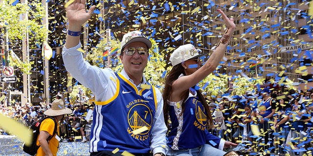 Golden State Warriors' owner Joe Lacob waves to fans during the Golden State Warriors Victory Parade on June 20, 2022 in San Francisco, California. The Golden State Warriors beat the Boston Celtics 4-2 to win the 2022 NBA Finals. 