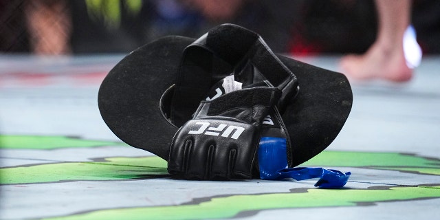 A detailed view of Donald Cerrone's cowboy hat and fight gloves during the UFC 276 event at T-Mobile Arena on July 02, 2022 in Las Vegas, Nevada. (Photo by Chris Unger/Zuffa LLC)