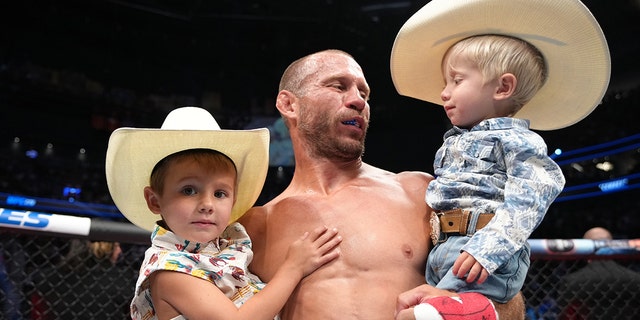 Donald Cerrone and sons in the Octagon during the UFC 276 event at T-Mobile Arena on July 02, 2022 in Las Vegas, Nevada. (Photo by Jeff Bottari/Zuffa LLC)